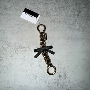Coach black leather bow keychain extender